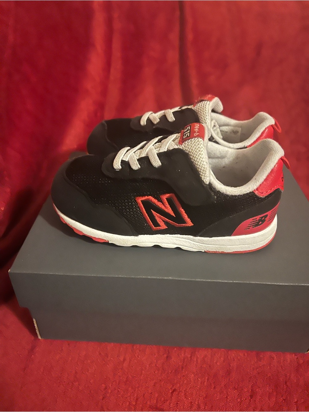 New Balance Kids Black and Red Low-Top Sneakers